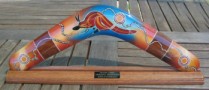 Personalized aboriginal boomerang on a stand with the custom engraving