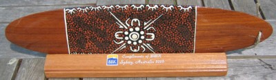 dot art bullroarer on custom printed stand